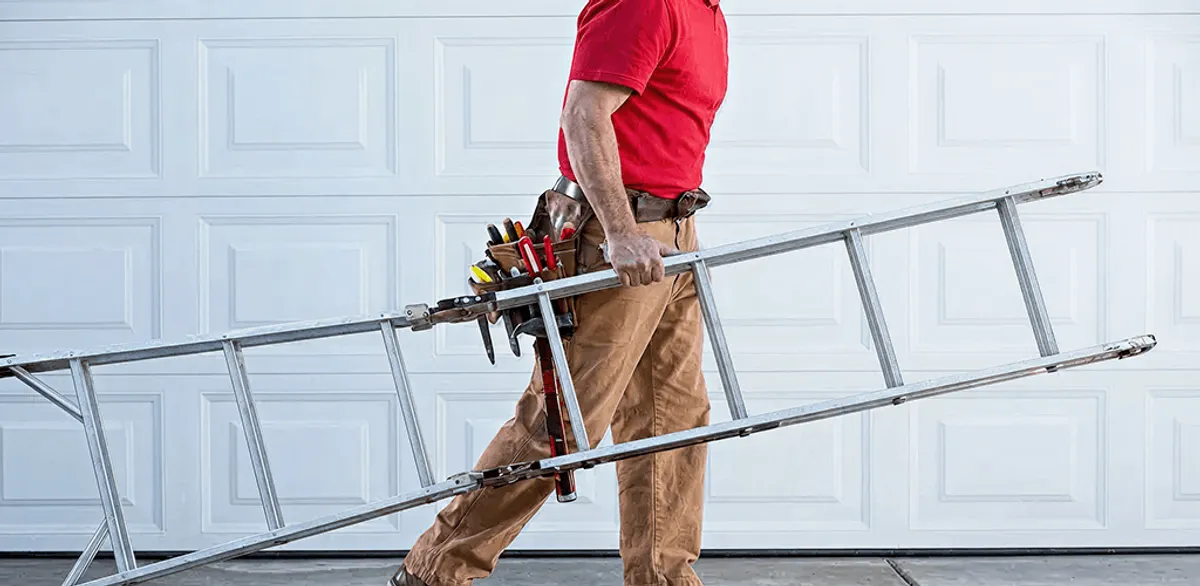 Garage door repair technician arriving with tools and ladder in Lincoln, NE